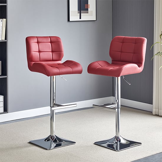 Read more about Candid bordeaux faux leather bar stools with chrome base in pair