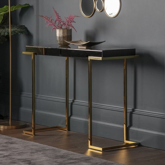 View Canela mirrored console table in black with gold metal legs