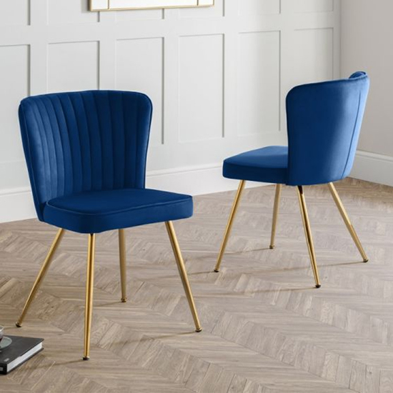 Photo of Caledon blue velvet dining chair with gold metal legs in pair