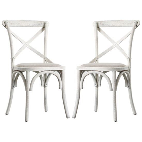 Photo of Caria cross back natural wooden dining chairs in a pair