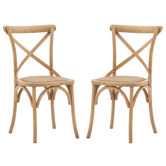 Photo of Caria natural wooden dining chairs with rattan seat in a pair