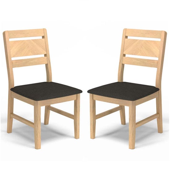 Photo of Carnial grey fabric upholstered dining chairs in a pair