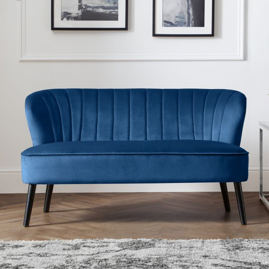 Photo of Caliste velvet 2 seater sofa in blue with black wooden legs