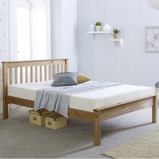 Photo of Celestas wooden small double bed in waxed pine