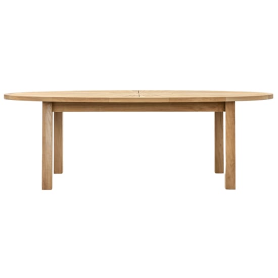 View Champil outdoor oval wooden dining table in natural