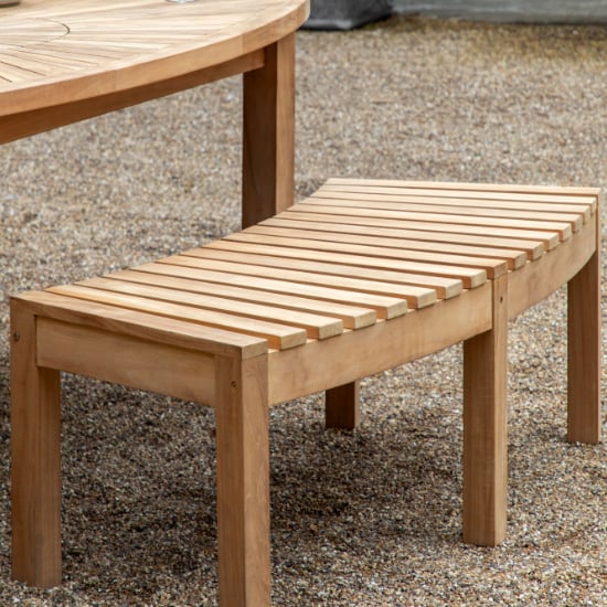 Photo of Champil outdoor wooden dining bench in natural