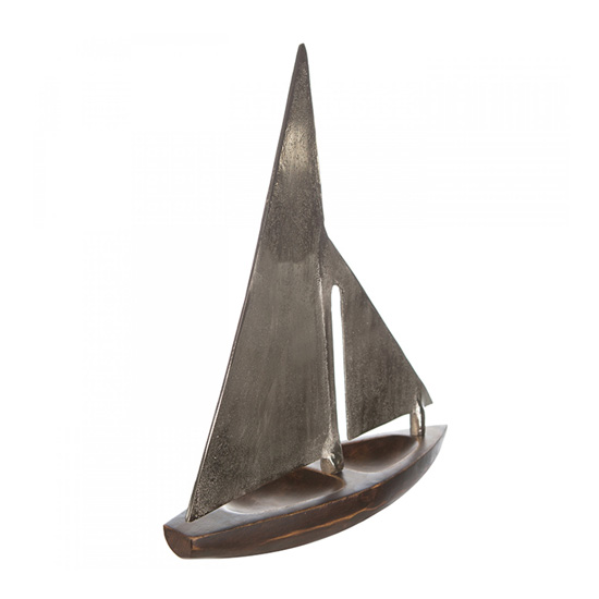 Photo of Classic small wooden sailing boat hull in brown