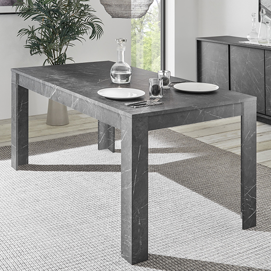 Photo of Corvi wooden dining table in black marble effect