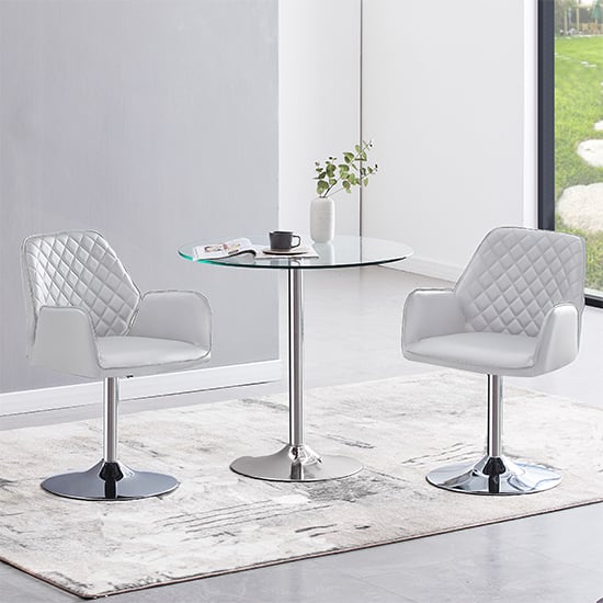 Photo of Dante clear glass dining table with 2 bucketeer white chairs