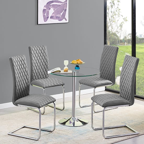 Photo of Dante round clear glass dining table with 4 ronn grey chairs