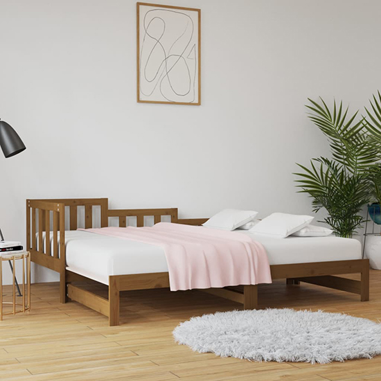 Product photograph of Davey Solid Pinewood Pull-out Single Day Bed In Honey Brown from Furniture in Fashion