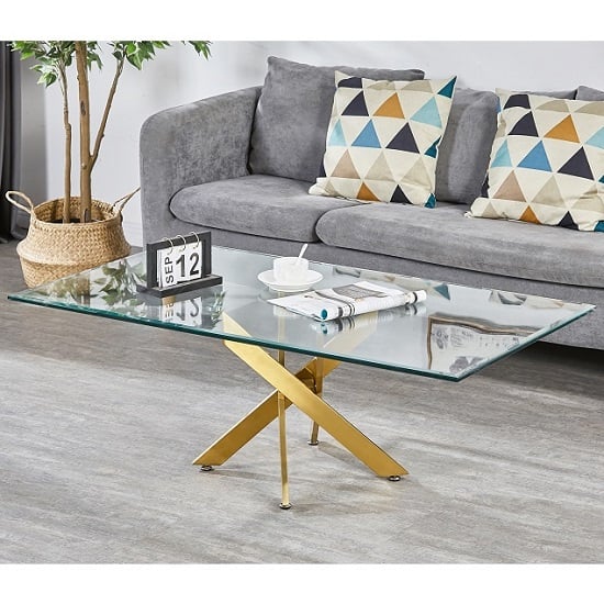 Photo of Daytona clear glass coffee table with brushed gold legs