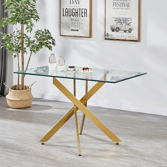 Photo of Daytona small clear glass dining table with brushed gold legs