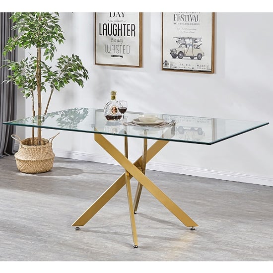 Photo of Daytona large clear glass dining table with brushed gold legs