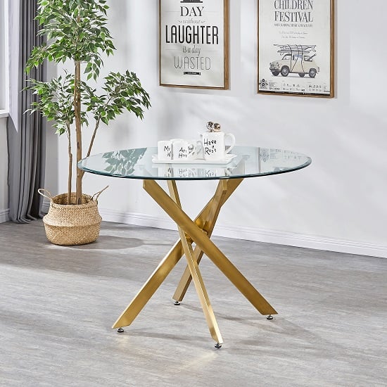 Photo of Daytona round clear glass dining table with brushed gold legs