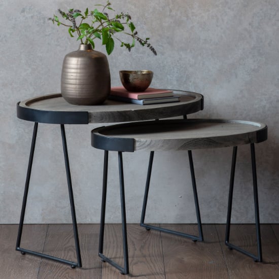 Photo of Dulstan round wooden nest of 2 tables with black metal base