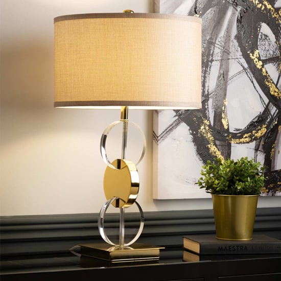 Photo of Dunn taupe faux silk shade table lamp with gold base