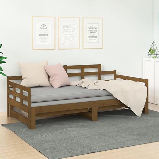 Product photograph of Elstan Solid Pine Wood Pull-out Single Day Bed In Honey Brown from Furniture in Fashion