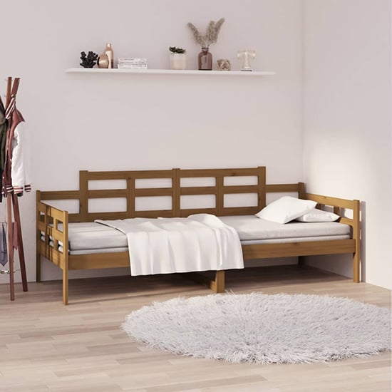 Product photograph of Elstan Solid Pine Wood Single Day Bed In Honey Brown from Furniture in Fashion