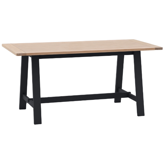 Product photograph of Elvira Trestle Wooden Dining Table In Oak And Meteror from Furniture in Fashion