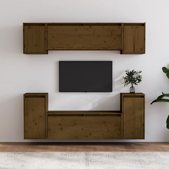 Photo of Falan solid pinewood entertainment unit in honey brown