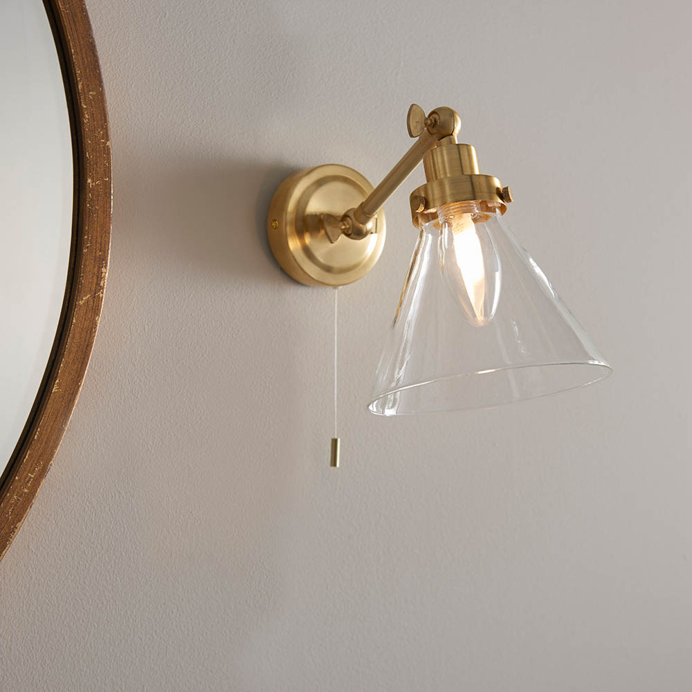 Read more about Faraday clear glass shade bathroom wall light in satin brass
