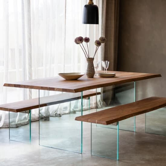 Photo of Ferno small wooden dining table with glass legs in natural