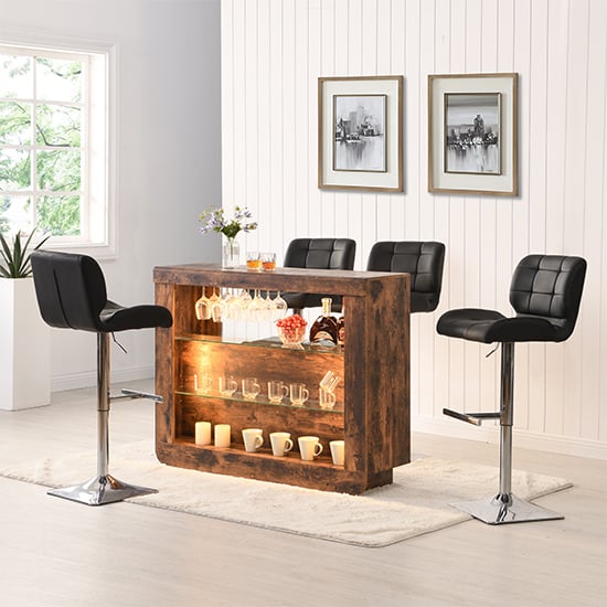 Photo of Fiesta smoked oak bar table unit with 4 candid black stools