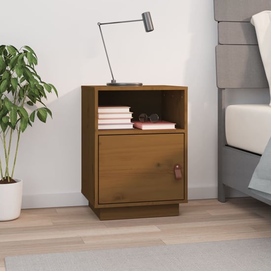 Read more about Fruma pine wood bedside cabinet with 1 door in honey brown