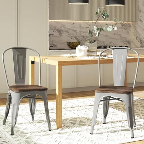 Photo of Fuzion wooden dining chairs with silver metal frame in pair
