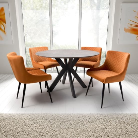 Photo of Gabri brown dining table round with 4 malmo orange chairs