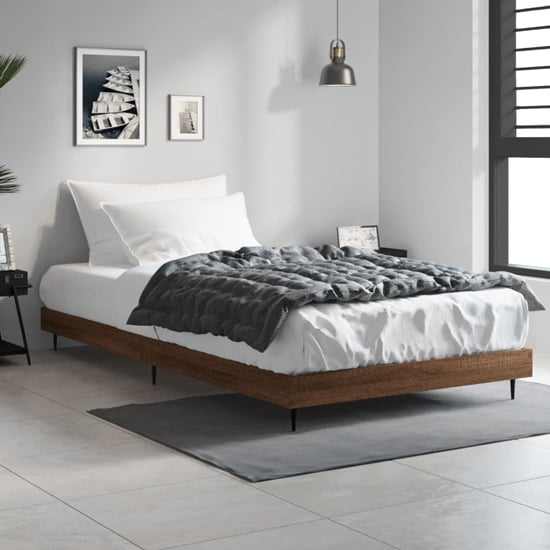 Read more about Gemma wooden single bed in brown oak with black metal legs