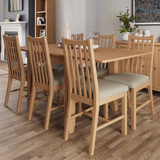 View Gilford extending 160cm light oak dining table with 8 chairs