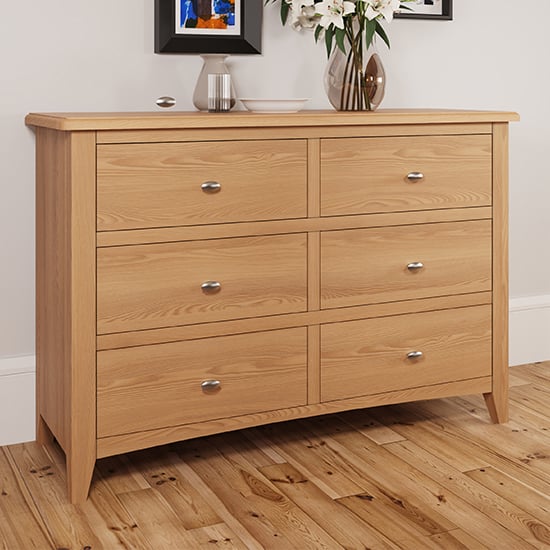 Photo of Gilford wide wooden chest of 6 drawers in light oak