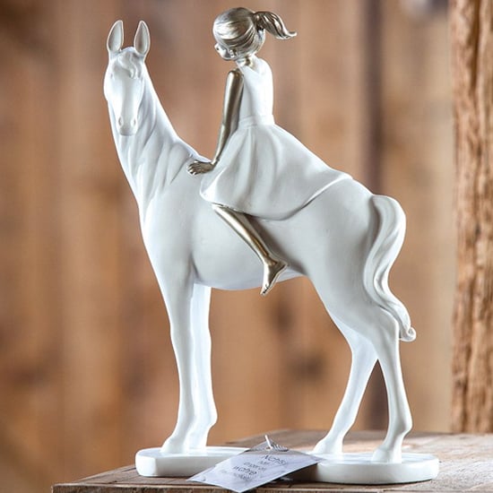 Read more about Girl on horse poly design sculpture in white and silver