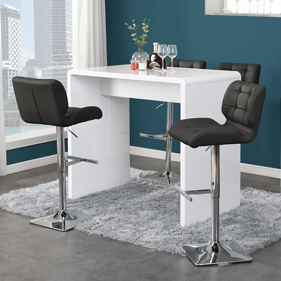 Photo of Glacier white high gloss bar table with 4 candid black stools