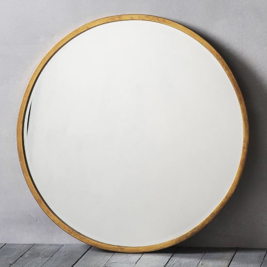 Photo of Haggen large round bedroom mirror in antique gold frame