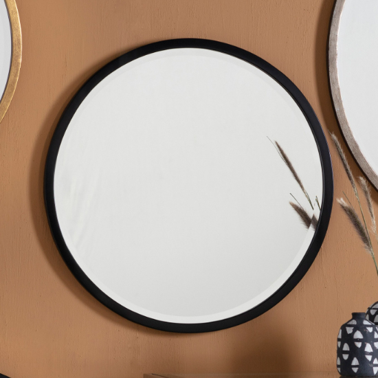 Read more about Haggen small round bedroom mirror in black frame