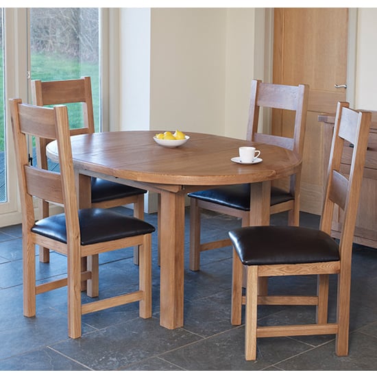 Photo of Hampshire round extending dining set with 4 chairs