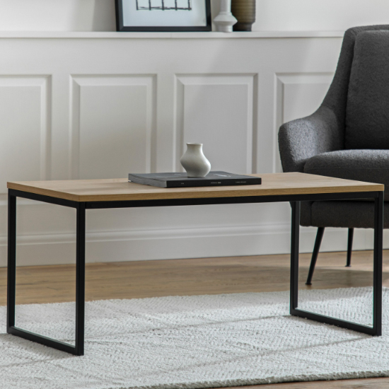 Photo of Hanley wooden coffee table with black metal frame in natural