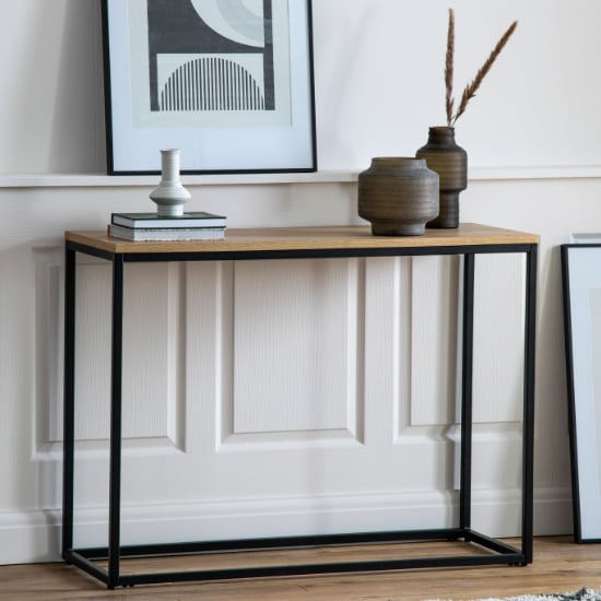 Photo of Hanley wooden console table with black metal frame in natural