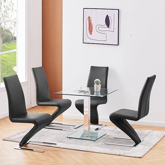 Photo of Hartley clear glass dining table with 4 demi z black chairs