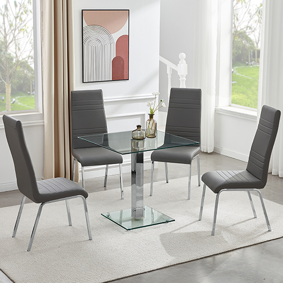 Photo of Hartley clear glass dining table with 4 dora grey chairs