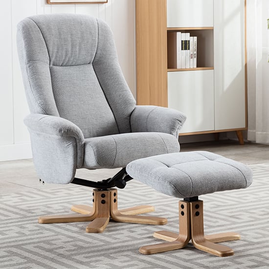 View Hatton fabric swivel recliner chair and footstool in cloud