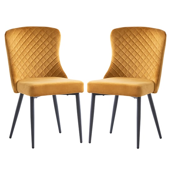 Read more about Helmi antique gold velvet dining chair with black legs in pair