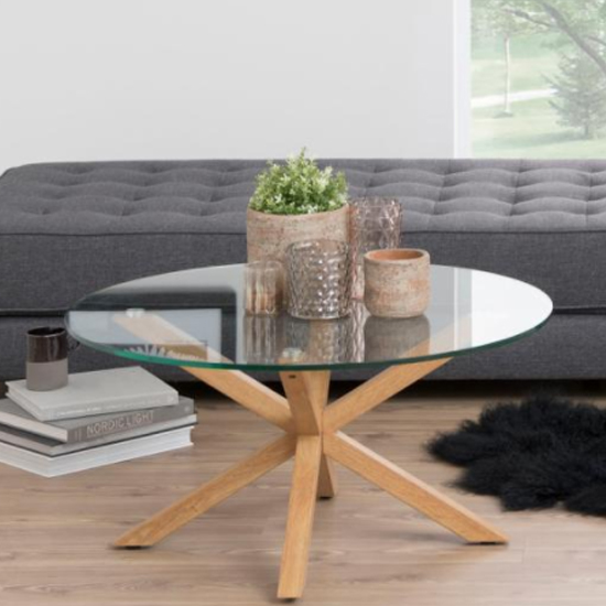 Product photograph of Herriman Round Clear Glass Coffee Table With Oak Legs from Furniture in Fashion