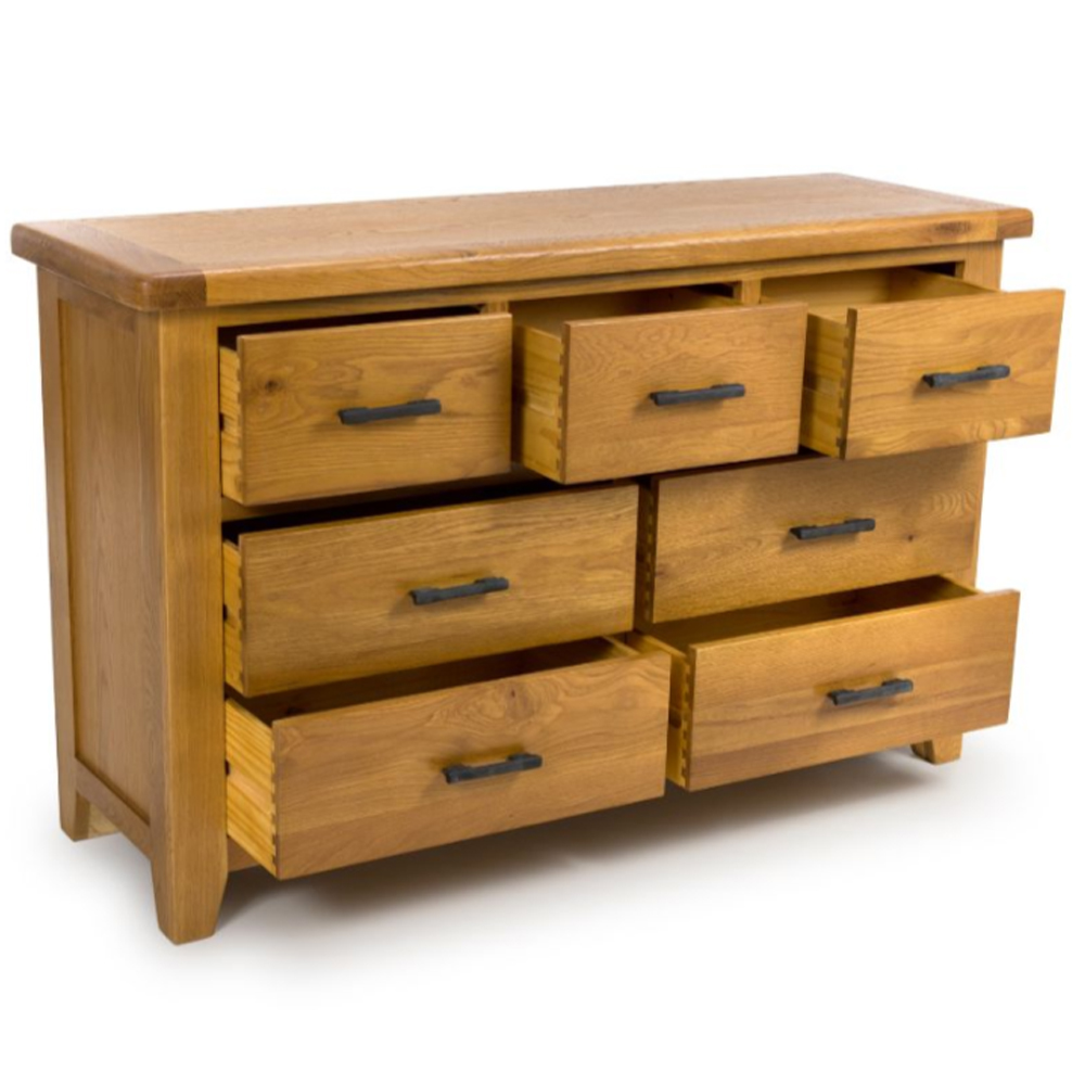 Hewitt Wide Wooden Chest Of 7 Drawers In Rustic Oak