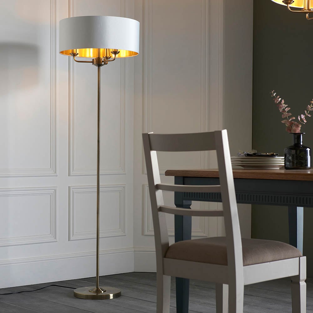 Read more about Hixson 3 light natural fabric floor lamp in antique brass