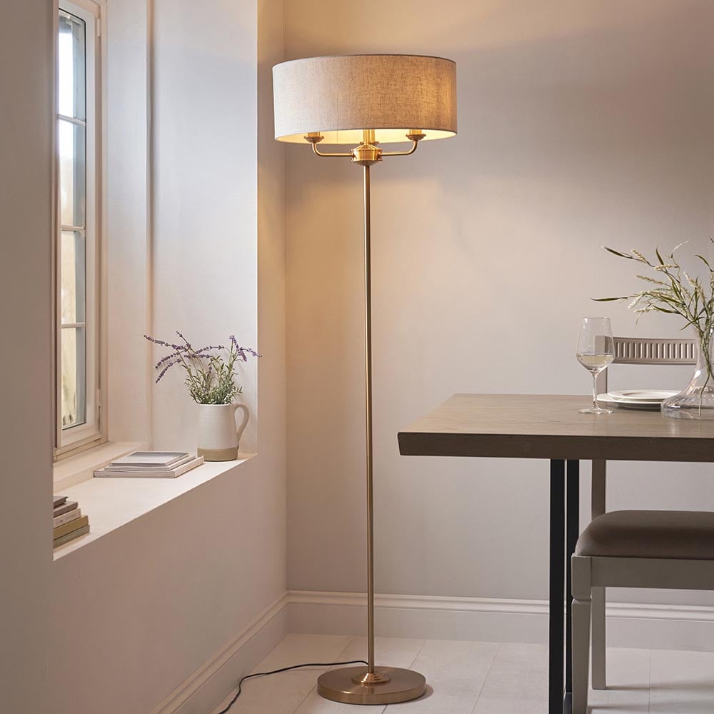 Read more about Hixson 3 light natural fabric floor lamp in vintage brass