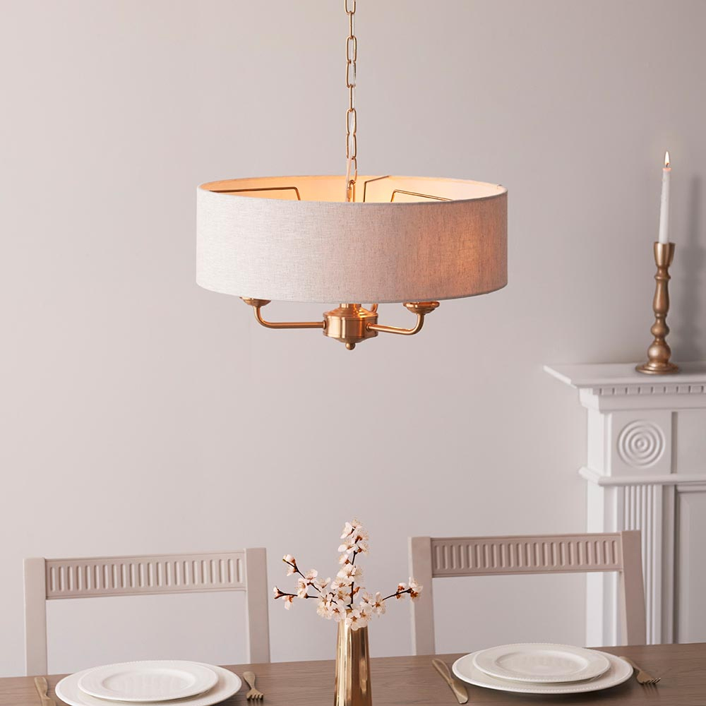 Read more about Hixson 3 light natural fabric pendant ceiling light in brass